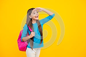 Happy teenager portrait. School teen girl in with backpack. Teenager student on isolated background. Kids learning