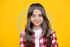 Happy teenager, positive and smiling emotions of teen girl. Portrait of beautiful happy smiling teenage girl on yellow