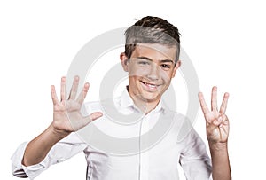 Happy teenager showing eight fingers, number 8 gesture