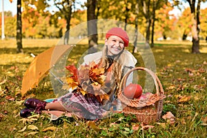 Happy teenager smiling. Autumn portrait of beautiful young girl in red hat