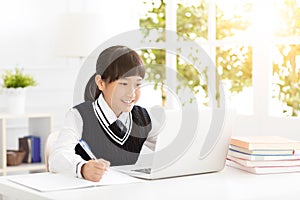 Happy teenager Student studying with laptop