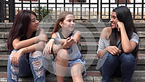 Happy Teens Girls Sitting Together