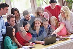 Happy teens group in school