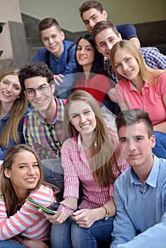 Happy teens group in school