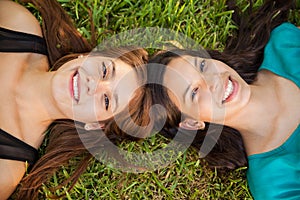 Happy teens relaxing at a park