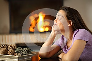 Happy tenant resting beside a fireplace at home