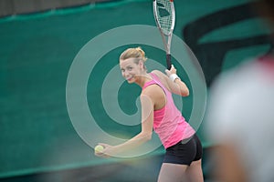 Happy tennis player getting ready to serve