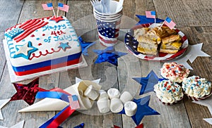 Happy 4th of July cake with cupcakes, marshmallows and hot dogs