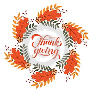 Happy Thanksgiving calligraphy brush lettering. Wreath of colorful autumn leaves, flowers and berries. Thanksgiving Day greeting