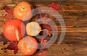 Happy Thanksgiving concept, greeting card, Autumn background with seasonal pumpkins,leaves,nuts and flowers on wooden background,