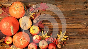 Happy Thanksgiving concept, greeting card, Autumn background with seasonal pumpkins,leaves,nuts and flowers on wooden background,