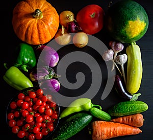 Happy Thanksgiving Day background, black wooden table decorated with pumpkins and autumn vegetables. Harvest festival. Colorful