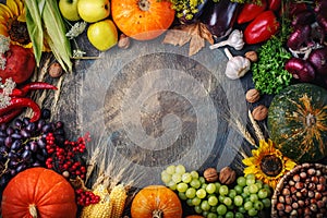 Happy Thanksgiving Day background, a table decorated with pumpkins, corn and autumn leaves.