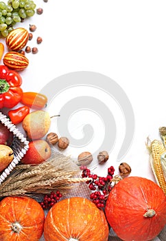 Happy Thanksgiving Day background, table decorated with Pumpkins, Maize, fruits and autumn leaves. Harvest festival. The