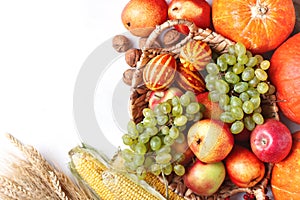 Happy Thanksgiving Day background, table decorated with Pumpkins, Maize, fruits and autumn leaves. Harvest festival. The