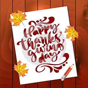 Happy Thanksgiving Day Calligraphy Text on sheet of paper with autumn leaves and wooden background. Vector Isolated