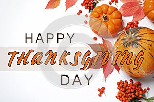 Happy Thanksgiving Day card. Flat lay composition with pumpkins, berries and autumn leaves on white background