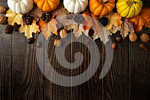 Happy Thanksgiving Day with pumpkin and nut on wooden table