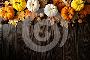 Happy Thanksgiving Day with pumpkin and nut on wooden table