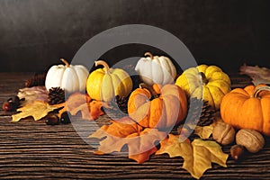 Happy Thanksgiving Day with pumpkin and nut on wooden table