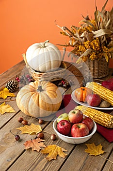 Happy Thanksgiving Day with Pumpkins and Corncobs photo