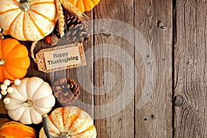 Happy Thanksgiving gift tag with side border of pumpkins and autumn decor over a wood background