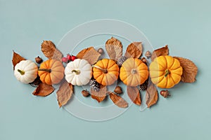 Happy Thanksgiving holiday background from autumn foliage, pumpkins and fall decorations top view