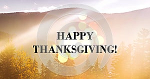 Happy Thanksgiving - holiday message on mountain landscape backdrop