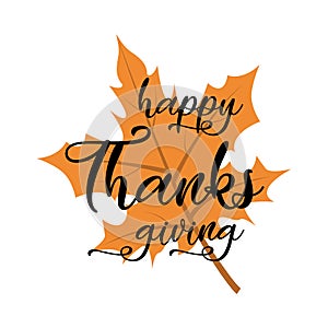 Happy Thanksgiving lettering on the autumn orange leaf.