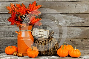 Happy Thanksgiving tag with autumn decor against wood