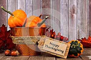 Happy Thanksgiving tag, and autumn decor with rustic wood background