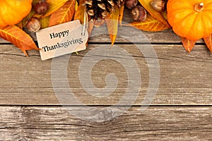 Happy Thanksgiving tag with autumn top border on rustic wood