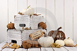 Happy Thanksgiving tag with decor against white wood