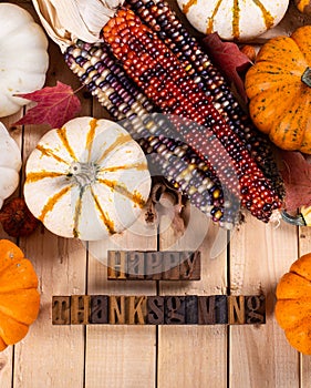 Happy Thanksgiving Text With Pumpkins and Corn