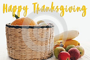 Happy Thanksgiving text, seasons greeting card concept. Thanksgiving sign. Pumpkin, zucchini, apples, pears on white wooden table