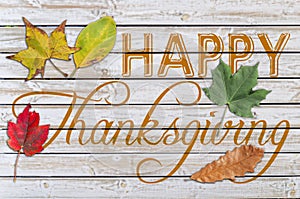 Happy Thanksgiving written on white wooden table