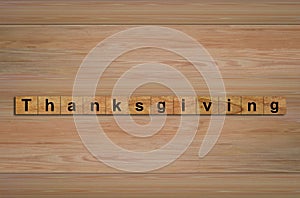 Happy Thanksgiving written on wood cubes.