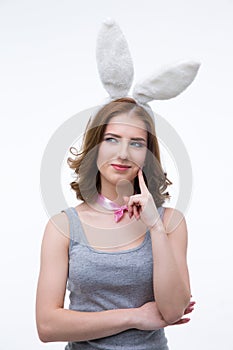 Happy thoughtful woman in rabbit ears