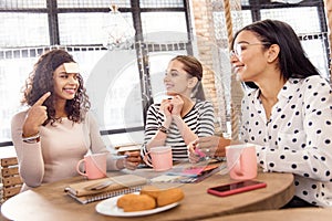 Happy three friends making round of game