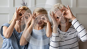 Happy three generations female family having fun together at home.