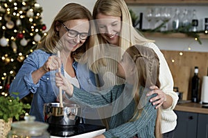 Happy three generations in the kitchen during Christmas baking