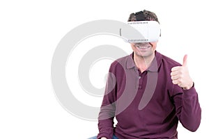Happy thumbs up man using virtual reality headset