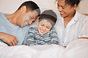 Happy, tickle and funny with family in bedroom for playful, morning and love. Care, support and wake up with parents and