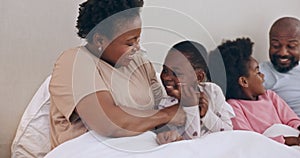 Happy, tickling and black family having fun in bed together at modern home for bonding. Smile, love and African mother