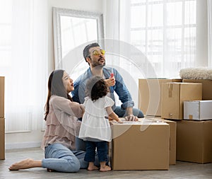 Happy time family blow soap bubbles relax in living room. Everyone having fun in the house