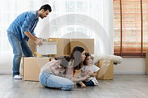 Happy time family blow soap bubbles relax in living room. Everyone having fun in the house