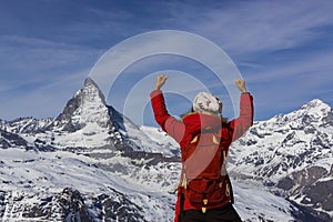 Happy time with sucessful of young woman mood in Matterhorn and Zermatt view at Switzerland photo