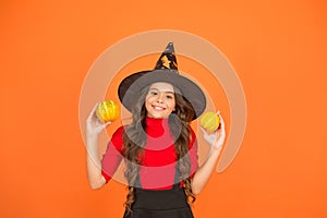 Happy to be around. childhood leisure. jack o lantern. happy halloween. kid wear witch hat. child with small pumpkin