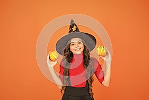 Happy to be around. childhood leisure. jack o lantern. happy halloween. kid wear witch hat. child with small pumpkin