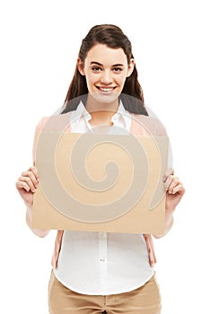 Happy to endorse your brand. Smiling young woman holding up a small poster of copyspace.